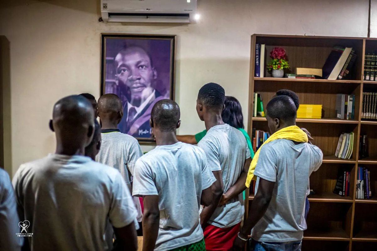 Participants standing in the library during a session