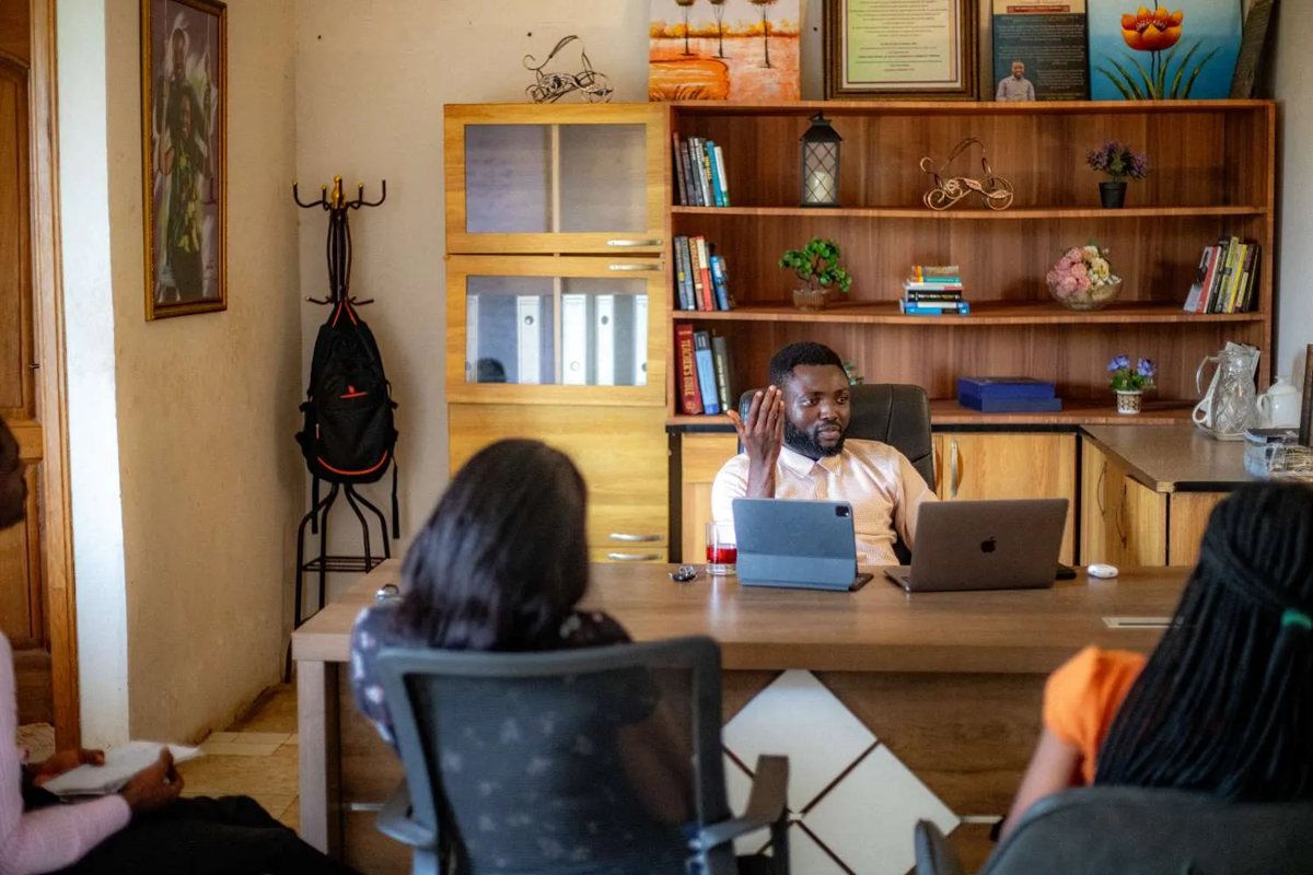 N.K. Emmanuel at his desk in the office library