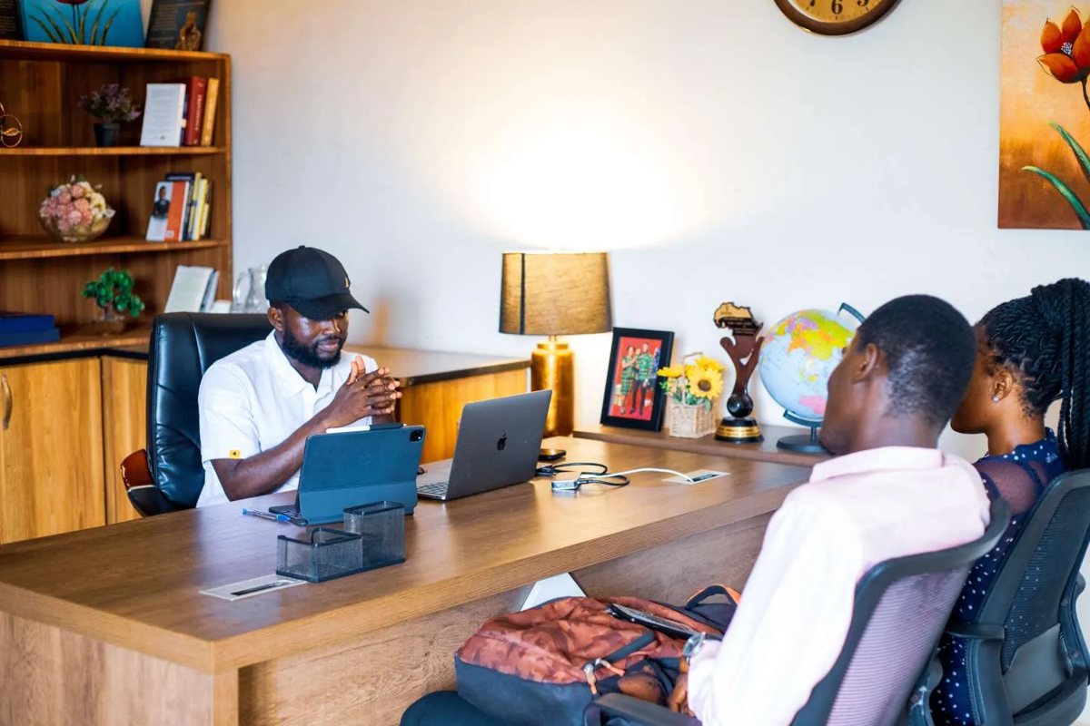 A mentoring conversation across an office desk