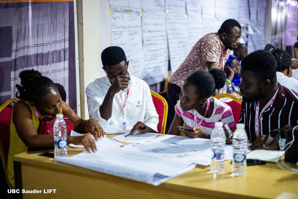 Participants planning on flip-chart paper